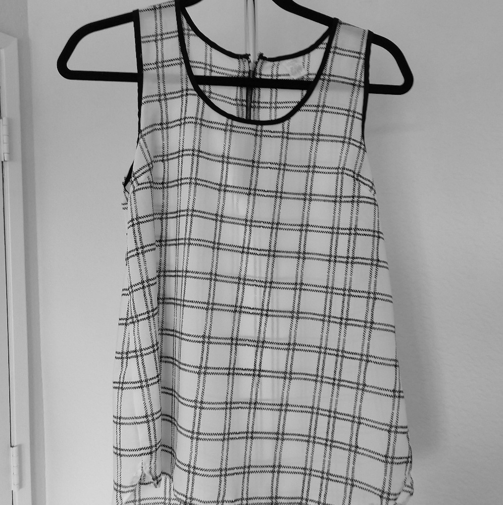 Sleeveless black and white blouse